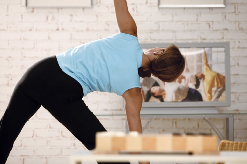 Woman exercising along with exercise video