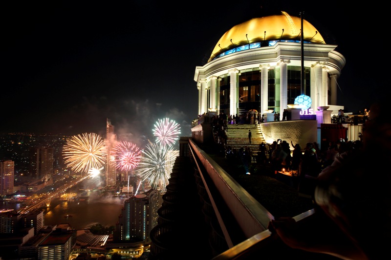 Bangkok ball drop at lebua 2014 with fireworks on the Chao Praya River.