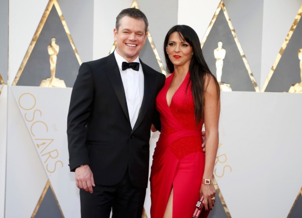 Matt Damon, nominated for Best Actor for his role in "The Martian," arrives with his wife Luciana Barroso at the 88th Academy Awards in Hollywood, California February 28, 2016. REUTERS/Lucy Nicholson