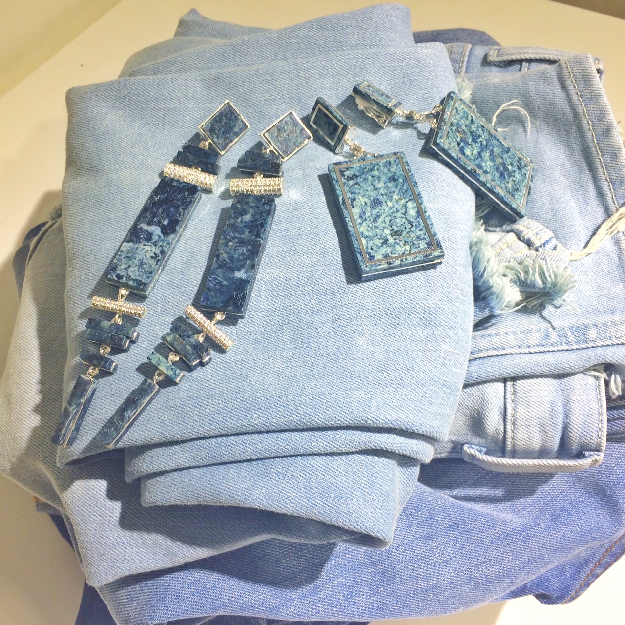 These 2 pairs of earrings are made of Denimite − a material made out of recycled worn-out denim