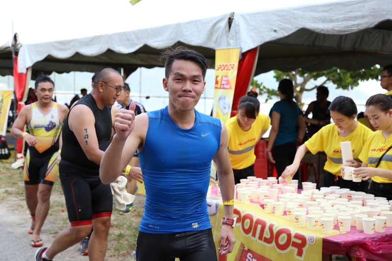 Participants receiving Sponsor, sports drink at the water station