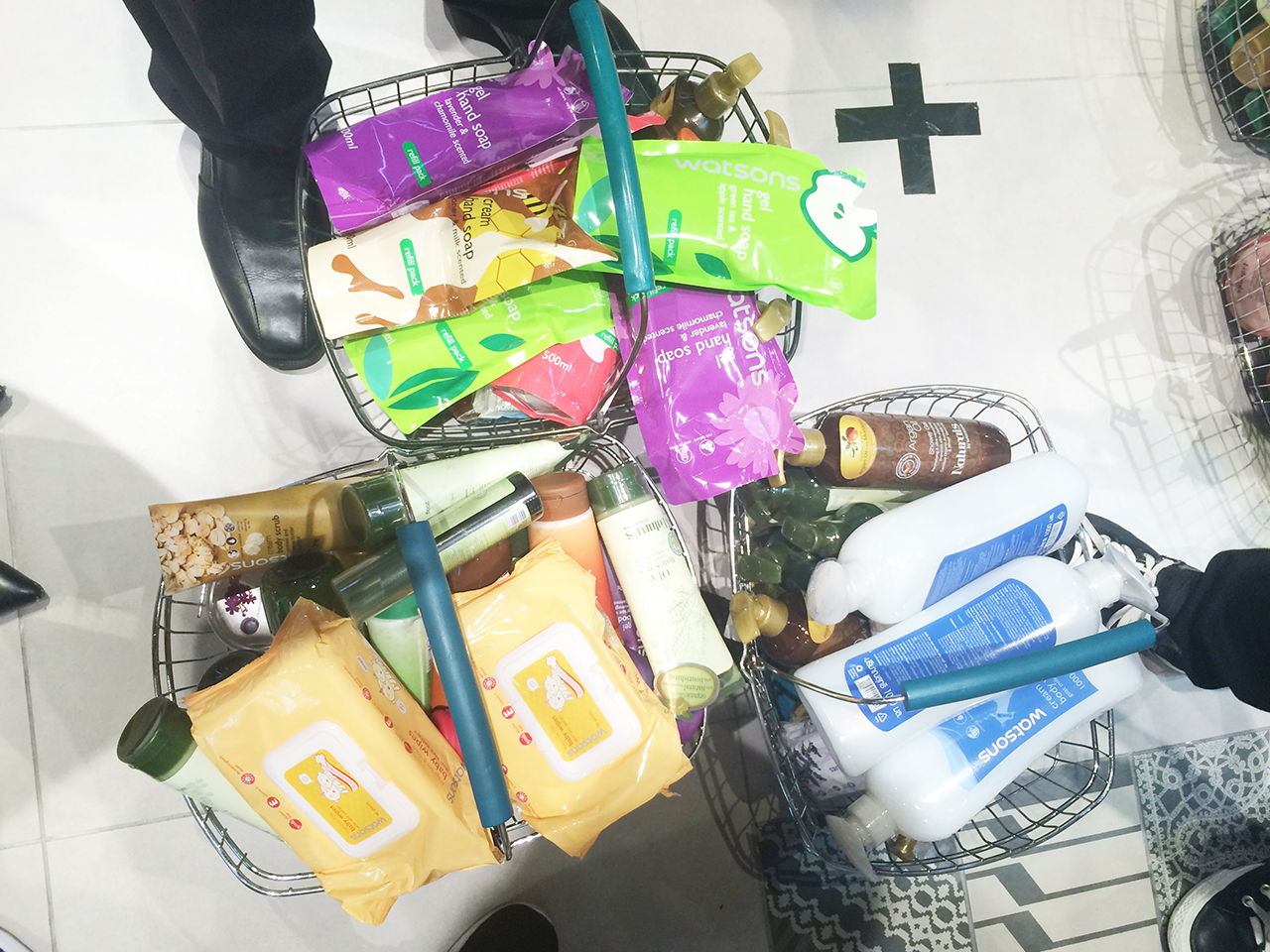 3 baskets full of the Watsons brand products that were grabbed by the winning team