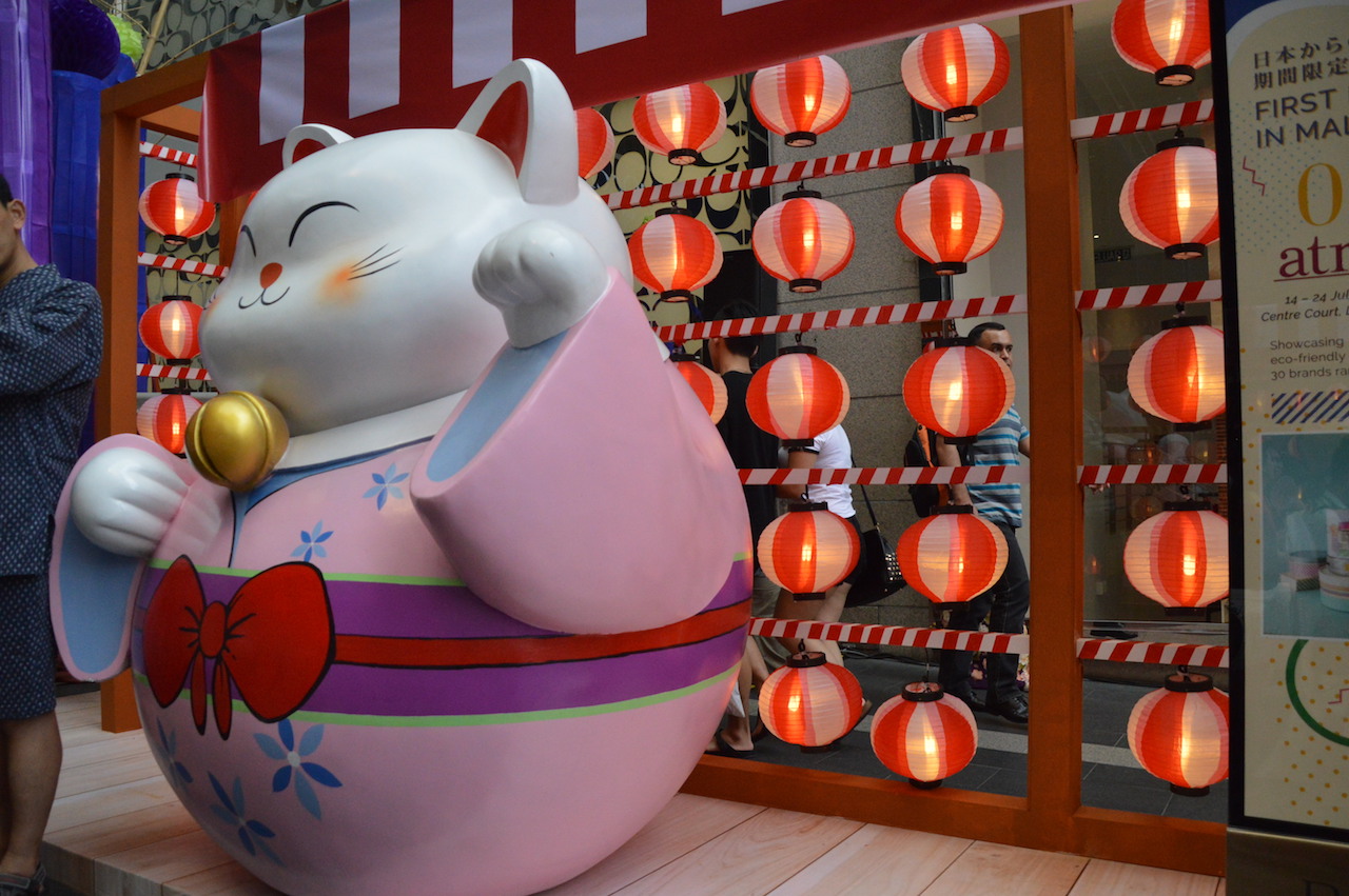 The giant maneki-neko - lucky cat displays at the entrance of Pavilion KL