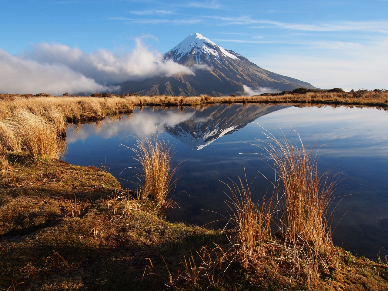 Sunset reflections, Pouakai Range, Egmont National Park, New Zealand (Image: GettyRF_168349602 - Taranaki)