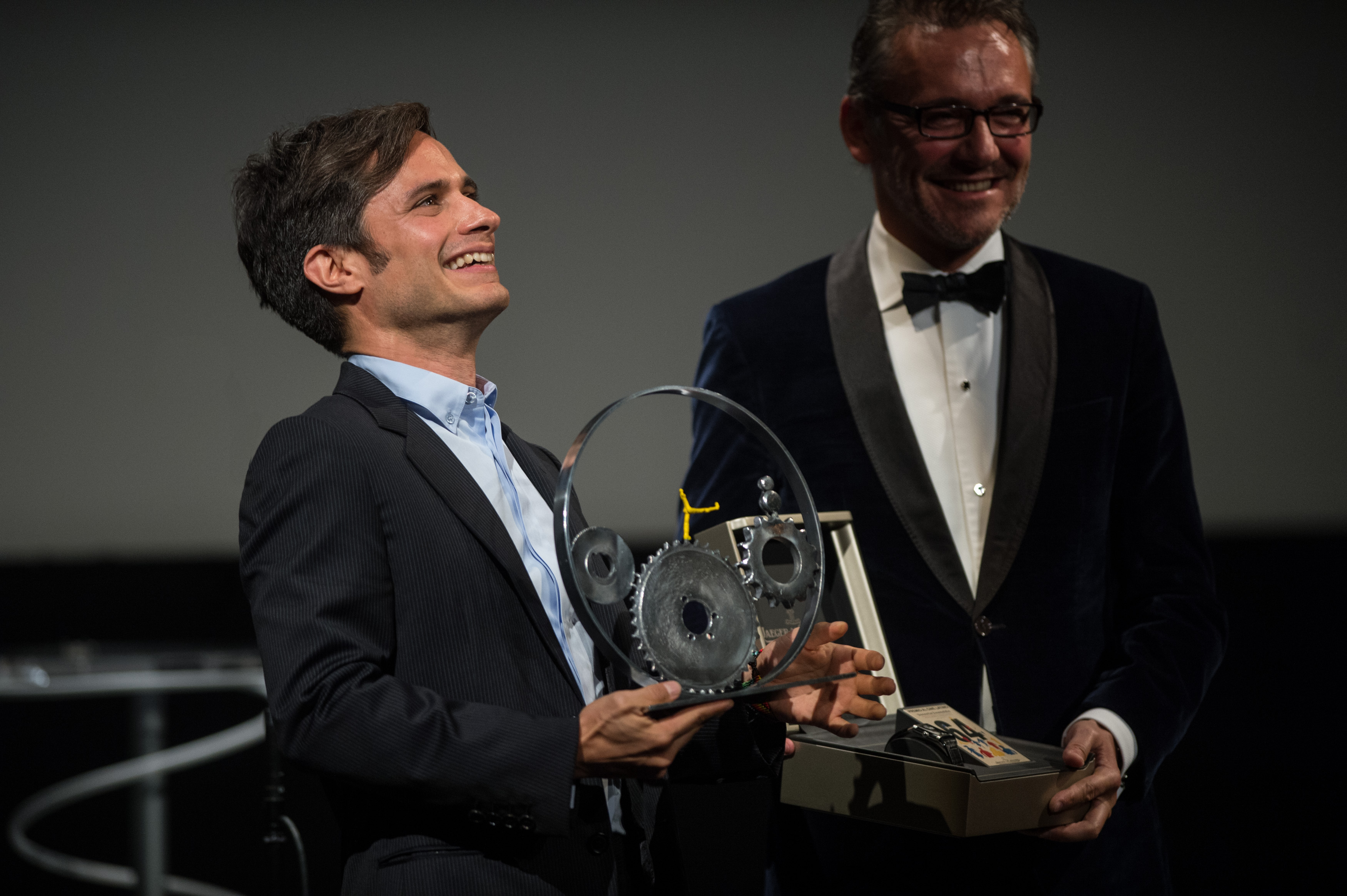 Gael Garcia Bernal receives the Jaeger-LeCoultre Latin Cinema Award from Laurent Vinay, international communications director of Jaeger-LeCoultre, at Victoria Eugenia Theatre during 64th San Sebastian Film Festival on September 17, 2016 in San Sebastian, Spain...