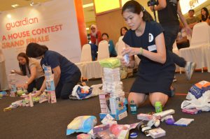 Guardian WAH Contest finalists stacking a tower with products - Pamper.My