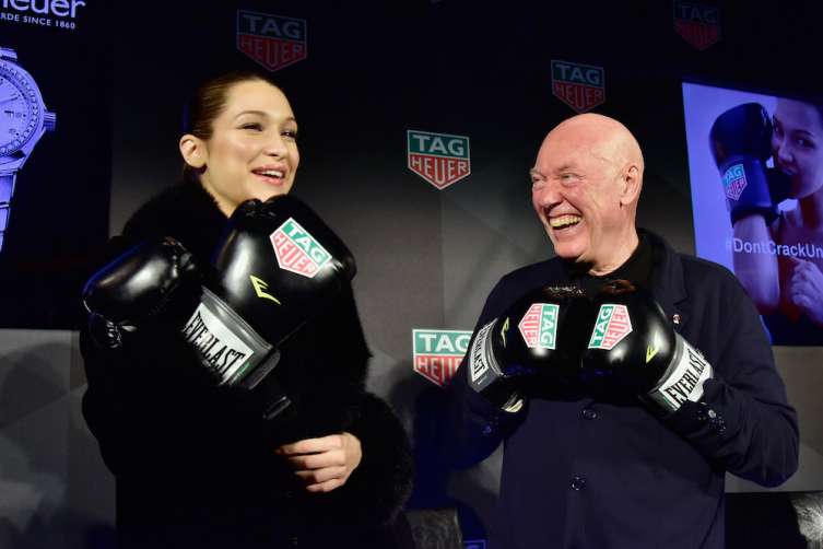CEO of TAG Heuer Jean-Claude Biver (L) and Bella Hadid.