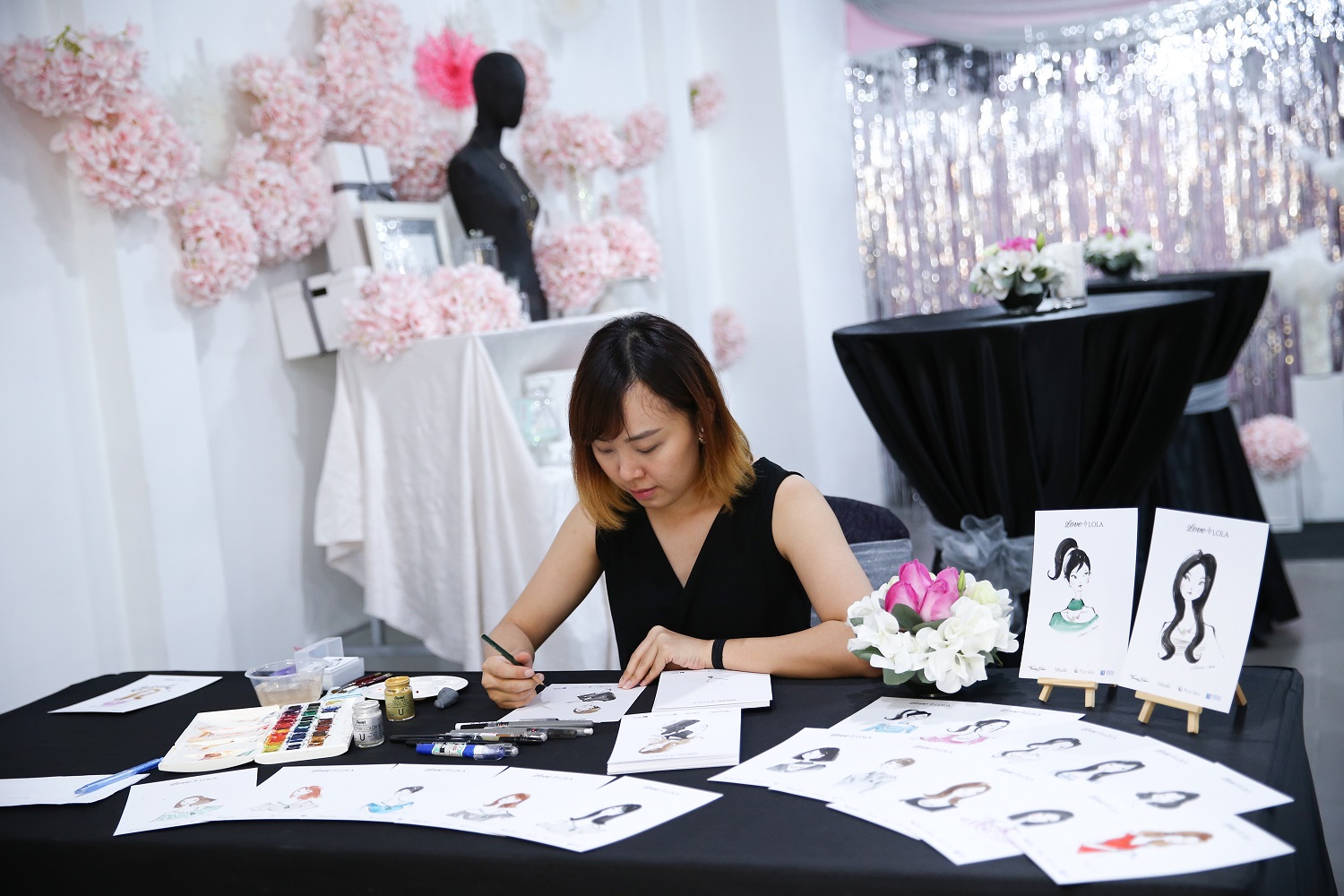 Love Lola launch,Illustrator Eleen Tan putting her finishing touches on her illustrations-Pamper.my
