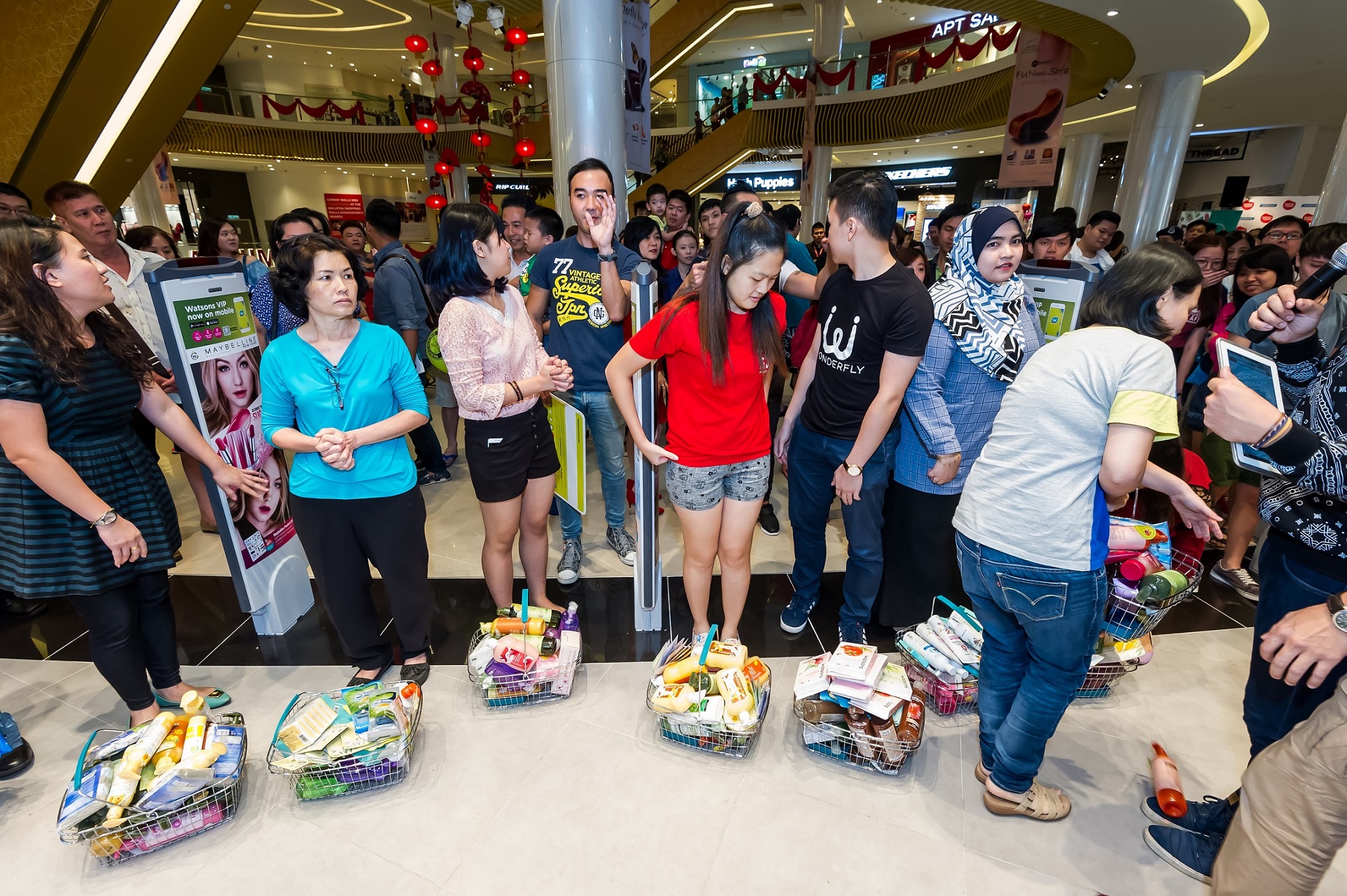 Watsons VIP Members with their shopping basket filled with Watsons Brand products after the shopping spree.