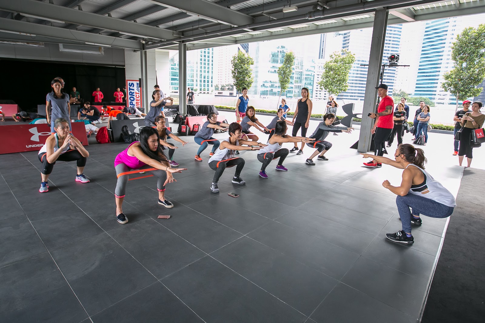 Nana al Haleq, Under Armour brand ambassador, conducting Booty Pump workshop for female participants. 