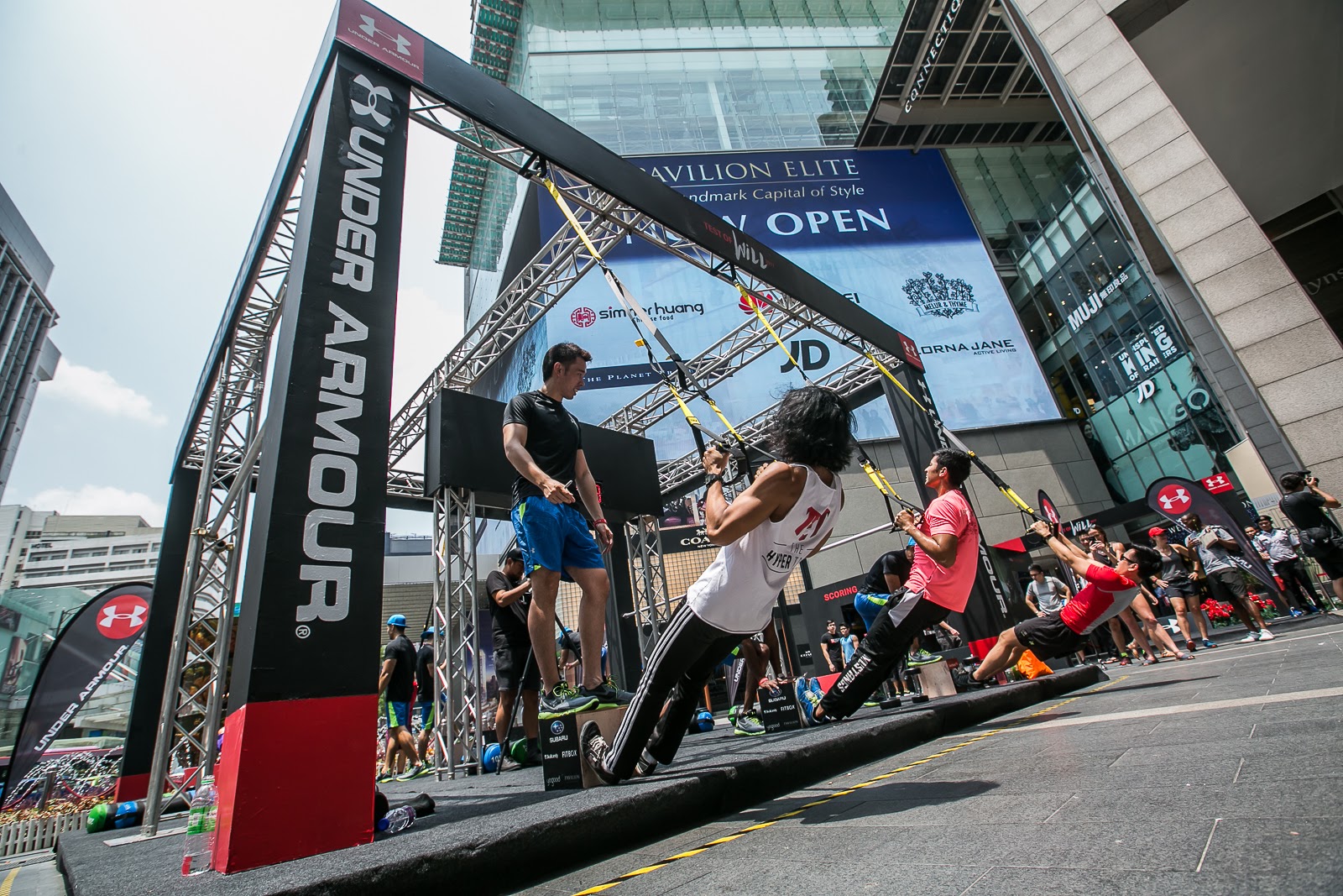 Contestants challenging one minute TRX Rows to achieve as many reps as possible.