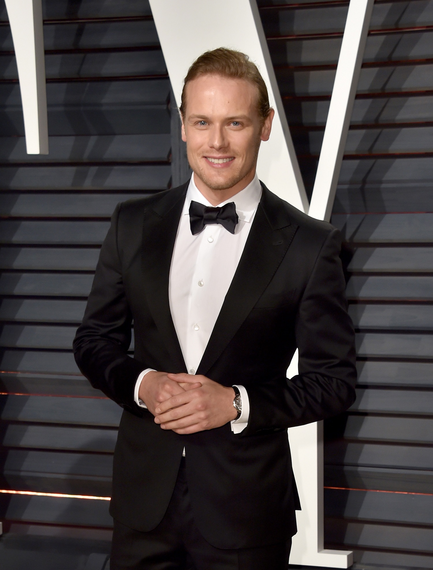 Sam Heughan at the 2017 Vanity Fair Oscar Party in Piaget-Pamper.my