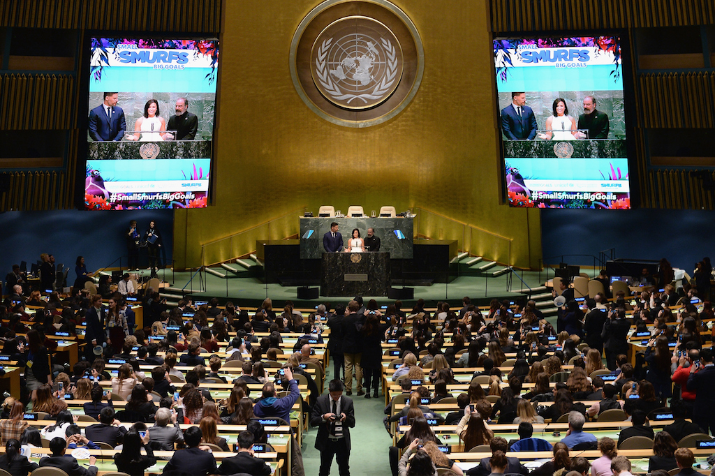 NEW YORK, NY - MARCH 18: UN Young Sustainable Development Goals Advocates Sarina Divan, Karan Jerath, and Noor Samee onstage with actors Mandy Patinkin, Demi Lovato, and Joe Manganiello at the United Nations Headquarters celebrating International Day of Happiness in conjunction with SMURFS: THE LOST VILLAGE on March 18, 2017 in New York City. (Photo by Andrew Toth/Getty Images for Sony Pictures)