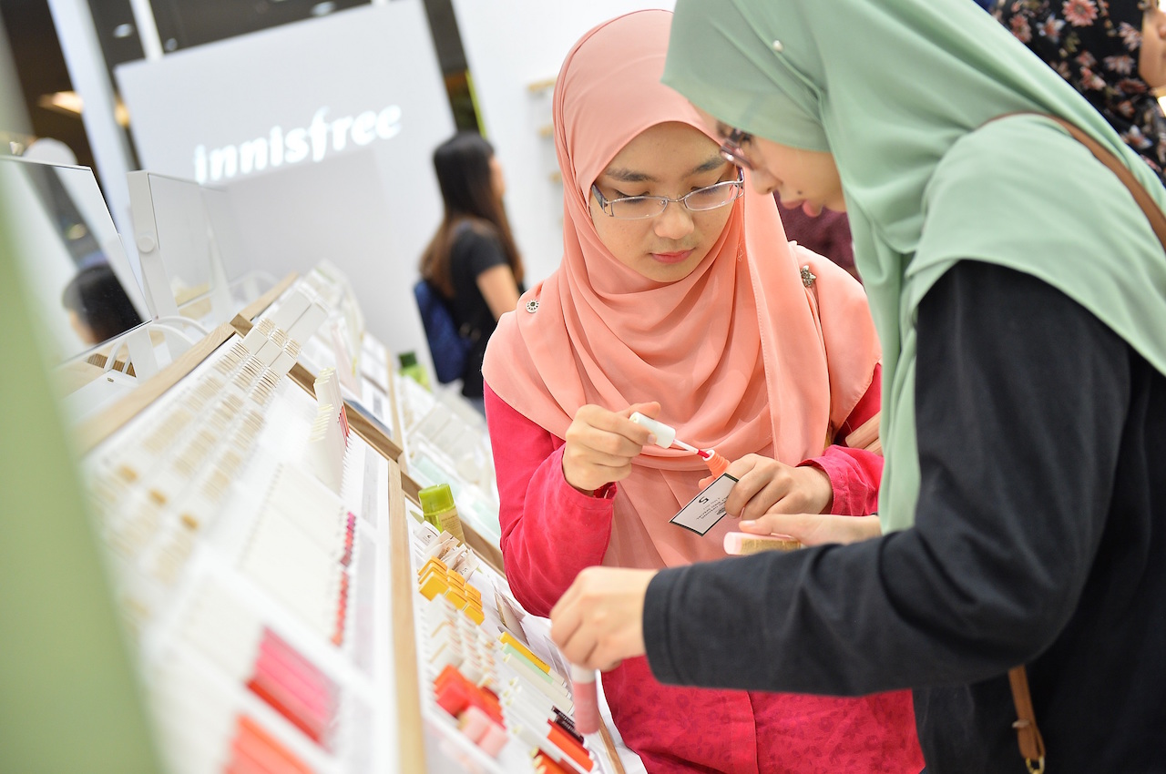 Customers enjoyed testing out innisfree beauty products during the opening.