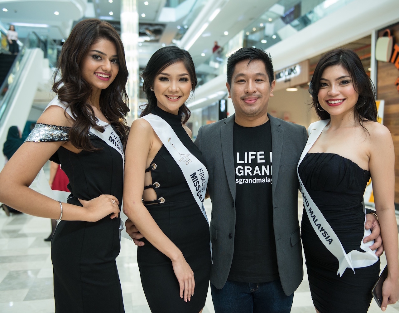 (Second from right) Jude Benjamin and three of the finalists of Miss Grand Malaysia 2017