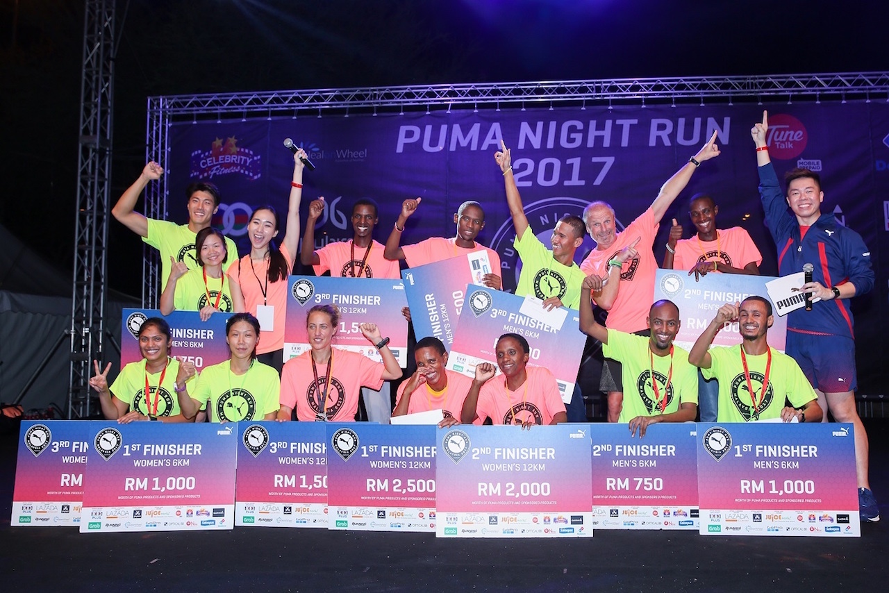 Peter Lee Jae Yoon (back row, first from left) and Philippe Le-Bretton (back row, third from right) posing with the 6KM & 12KM winners from both men and women's categories.