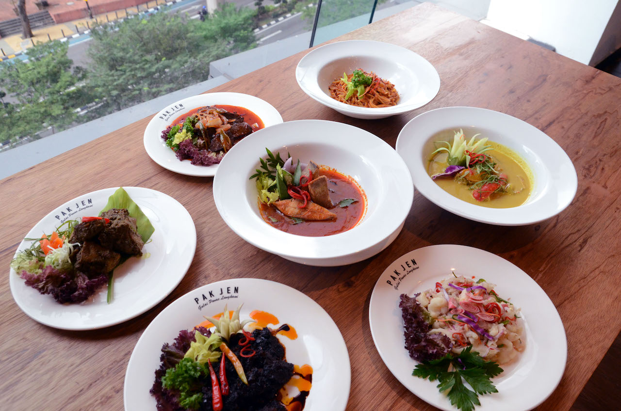 Gulai panas ikan bawal (middle), spaghetti Pak Jen, arnab masak lemak, kerabu kaki ayam, dendeng daging, itik golek and daging wagyu masak merah (clockwise from top)