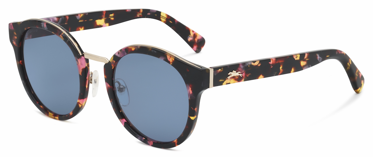LO603S The rounded shape of these acetate glasses is designed with a unique construction, consisting of three layers of acetate/metal/acetate. The front features a metal bridge bar, extending across the top from end to end; iconic customisations include the laser-engraved Longchamp logo on the right lens and the horse symbol on the left temple. The style comes with adjustable nose pads and metal hinges and bridge. Available in Marble Black, Havana, Havana Multicolor and Blue Tortoise. RRP : RM950