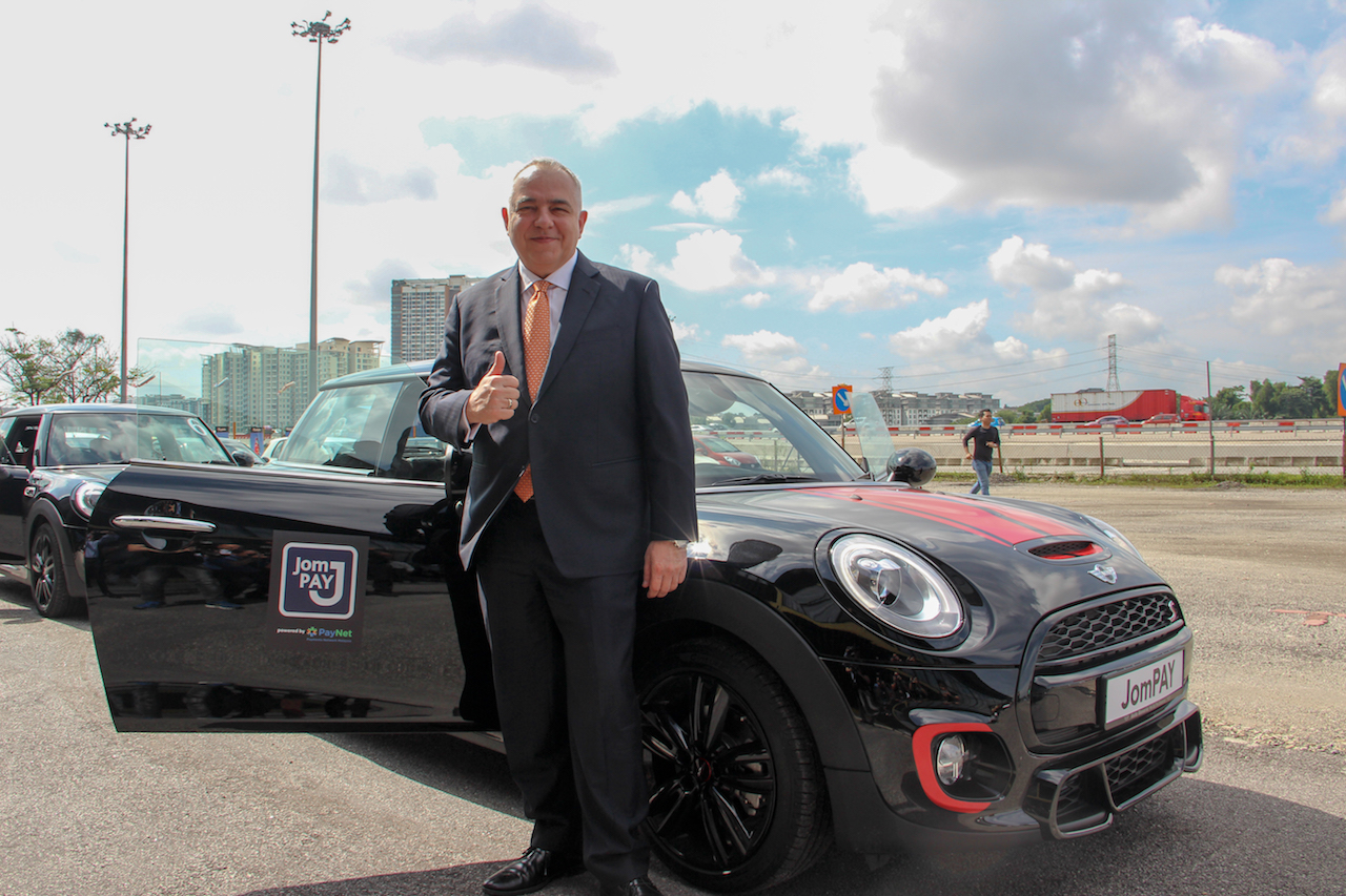 Mr Peter Schiesser, Group Chief Executive Officer of PayNet with the limited edition Mini John Cooper Works.