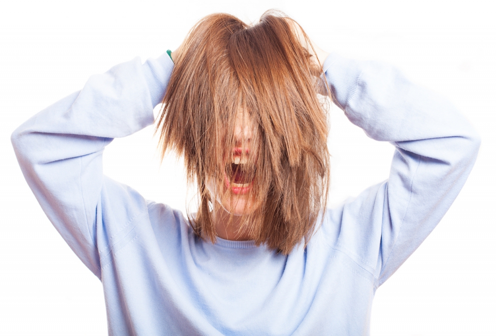 girl posing playing with her hair on a white background